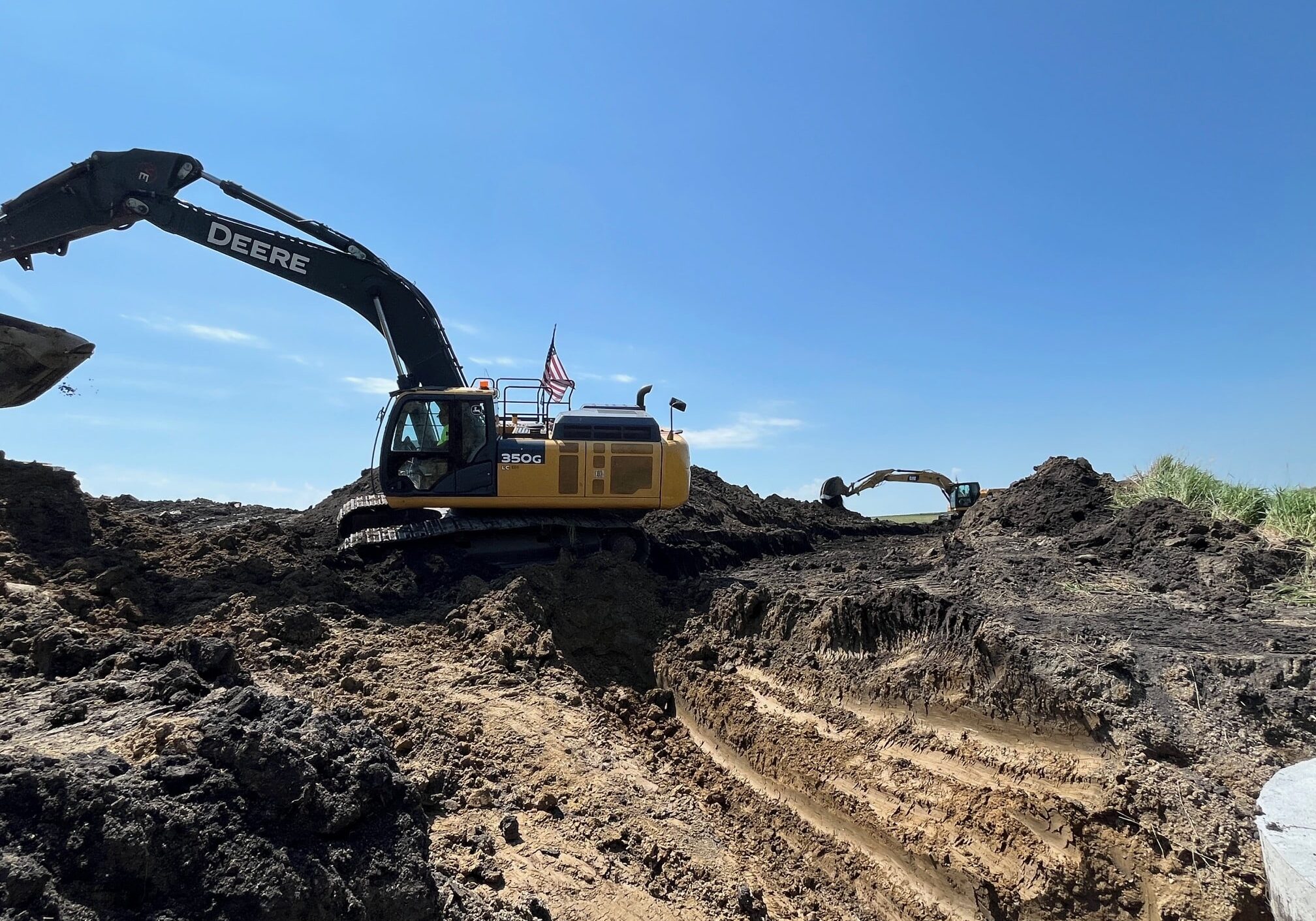 Excavator Working On Ditch Project